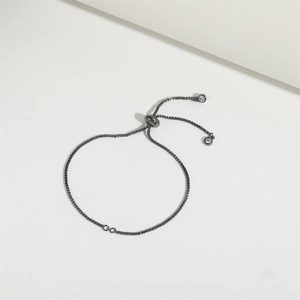 Adjustable gunmetal box chain bracelet featuring a slider clasp and sparkling zircon ends