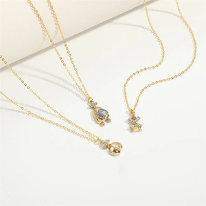 Elegant gold necklace set featuring windmill, pig, and money bag pendants with zircon