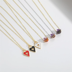 Quirky Halloween pumpkin and heart pendant necklaces with gold and silver chains