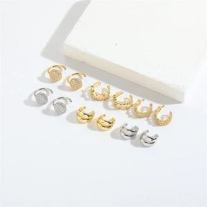Minimalist ball stud earrings and ear cuffs set in gold and silver with zircon accents