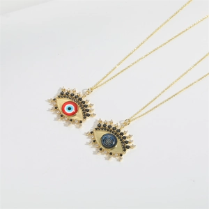 Exotic Evil Eye pendant necklace set in gold plating with crystal accents for women