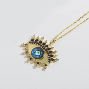 Macro shot of Devil's Eye pendant with blue enamel and colorful cubic zirconia stones