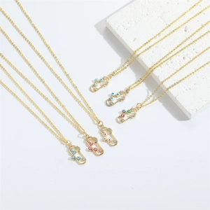 Exotic Evil Eye pill pendant necklaces in gold finish with colorful enamel accents