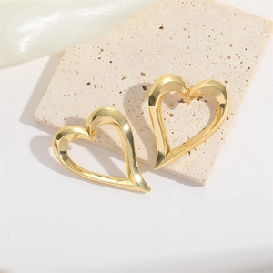Minimalist gold hollow heart earrings with high-polish metallic finish for women