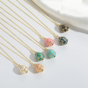 Vintage Faberge style egg pendants in multiple colors with gold floral engraving patterns