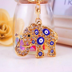 Elefant Schlüsselanhänger in Gold mit Kristallen und blauen türkischen Evil Eye Perlen