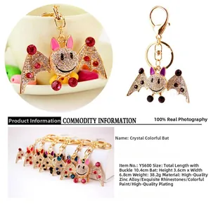 Detailed close-up showing rhinestone encrusted wings and enamel on the crystal bat keychain