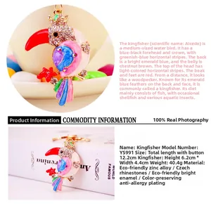 Detailed close-up of colorful enamel kingfisher keychain with sparkling Czech rhinestones