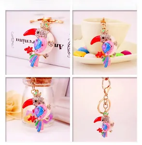 Detail view of colorful kingfisher keychain with vibrant rhinestones and enamel finish