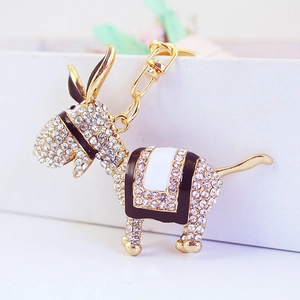 Sparkling rhinestone encrusted donkey keychain accessory in gold finish for women