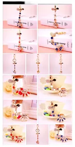 Detail of movable giraffe keychain with gold alloy finish and colorful enamel crystals