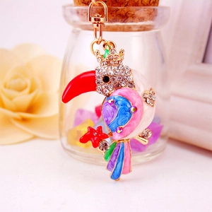 Colorful rhinestone parrot keychain featuring a toucan bird pendant and gold crown accents