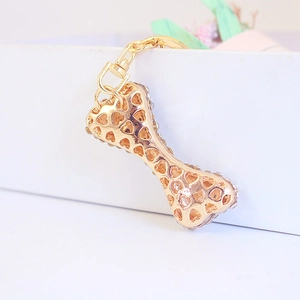 Cute gold dog bone keychain with heart hollow patterns and sparkling rhinestones for bags