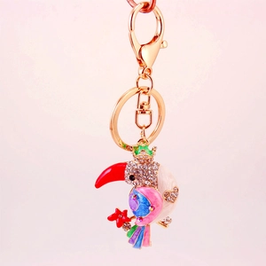 Colorful toucan keychain featuring gold-plated alloy with rhinestones and enamel finish