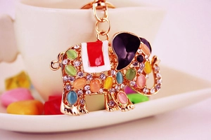 Close-up of elephant keychain with opal stones, rhinestones and colorful enamel detail