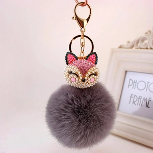 Pink rhinestone fox head keychain with grey faux fur pom pom and golden lobster clasp