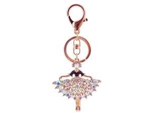 Detailed close-up of a golden ballerina keychain with colorful iridescent rhinestones