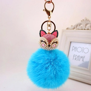 Sparkly fox head faux fur keychain with blue pompom and gold lobster clasp