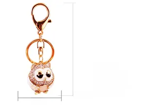 Detailed view of cat's eye owl keychain with dimensions showing 11.2cm total length