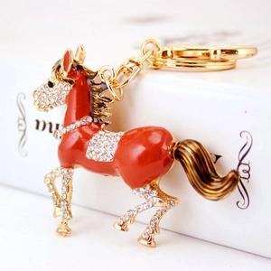 Charming red enamel zodiac horse keychain with sparkling crystals on gold metal alloy