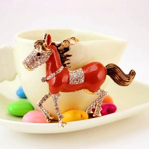 Elegant red enamel running horse keychain with sparkling rhinestone accents for bags and car keys