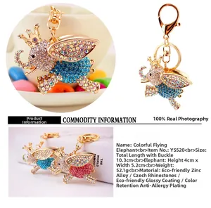 Detail view of rhinestone flying elephant keychain with dimensions and craft specs