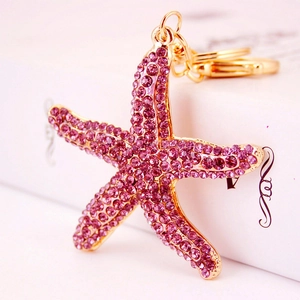 Sparkling pink starfish keychain with gold plating and rhinestone crystals for women