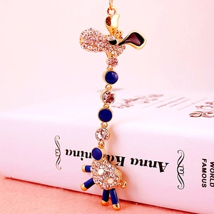 Exquisite gold giraffe keychain with sparkling white rhinestones and blue enamel accents