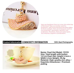 Detail of pink pearl and rhinestone sun hat keychain with golden metal ring for bags