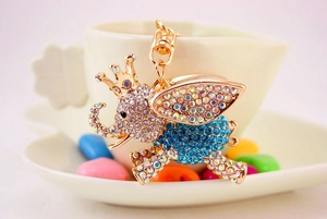 Detailed macro view of an elephant keychain with sparkling rhinestones and golden crown