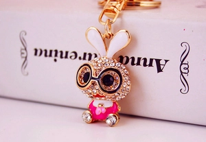 Detail of cartoon rabbit keychain with sparkling rhinestones and gold metal clasp