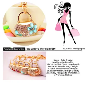 Close-up of golden alloy handbag keychain with colorful rhinestones and lobster clasp