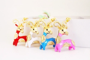 Detailed macro view of colorful goat keychains with shiny rhinestones and enamel finish