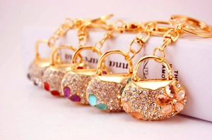 Detail of mini handbag keychains with multicolored rhinestones and gold alloy clips