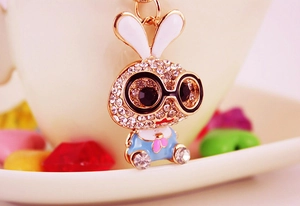 Close-up of a rabbit keychain with sparkling rhinestones and colorful enamel finish