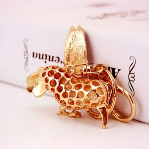 Elegant gold rooster keychain with hollow honeycomb pattern and sparkling crystals