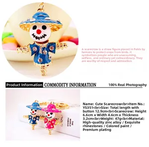 Detailed size specifications of the rhinestone scarecrow keychain in blue and pink finish