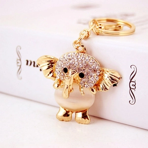 Creative elephant keychain with opal stone and rhinestones on a white gift box