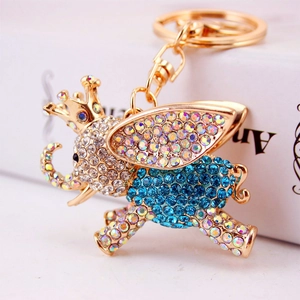 Cute flying elephant keychain with sparkling rhinestones and golden crown for bags