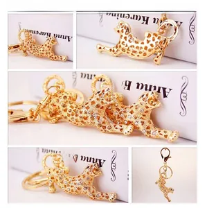 Detailed views of the rhinestone-studded leopard keychain with a gold-plated finish