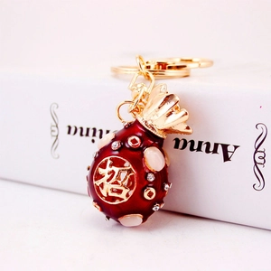 Red lucky money bag keychain with gold Fu character and sparkling crystal accents