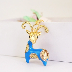 Creative goat keychain with blue enamel and sparkling rhinestones on golden metal link