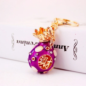 Creative purple rhinestone lucky bag keychain with gold plating and cai character