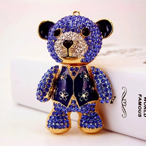 Luxury blue rhinestone bear keychain with gold accents and floral enamel vest