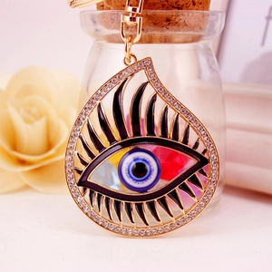Golden evil eye keychain pendant with sparkling rhinestones for car keys and bags