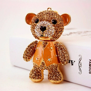 Sparkling crystal rhinestone oversized teddy bear keychain with amber gems and orange vest