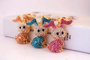 Detailed close-up of sparkling rhinestone bunny keychains with gold-tone alloy hooks