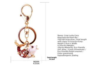 Detailed view of golden koi fish keychain with red enamel and sparkling Czech crystals