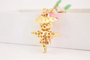 Detail of creative rhinestone scarecrow keychain with gold plated metal finish