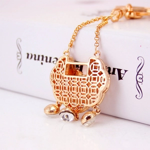 Exquisite gold Chinese longevity lock keychain with hollow coin pattern and crystals